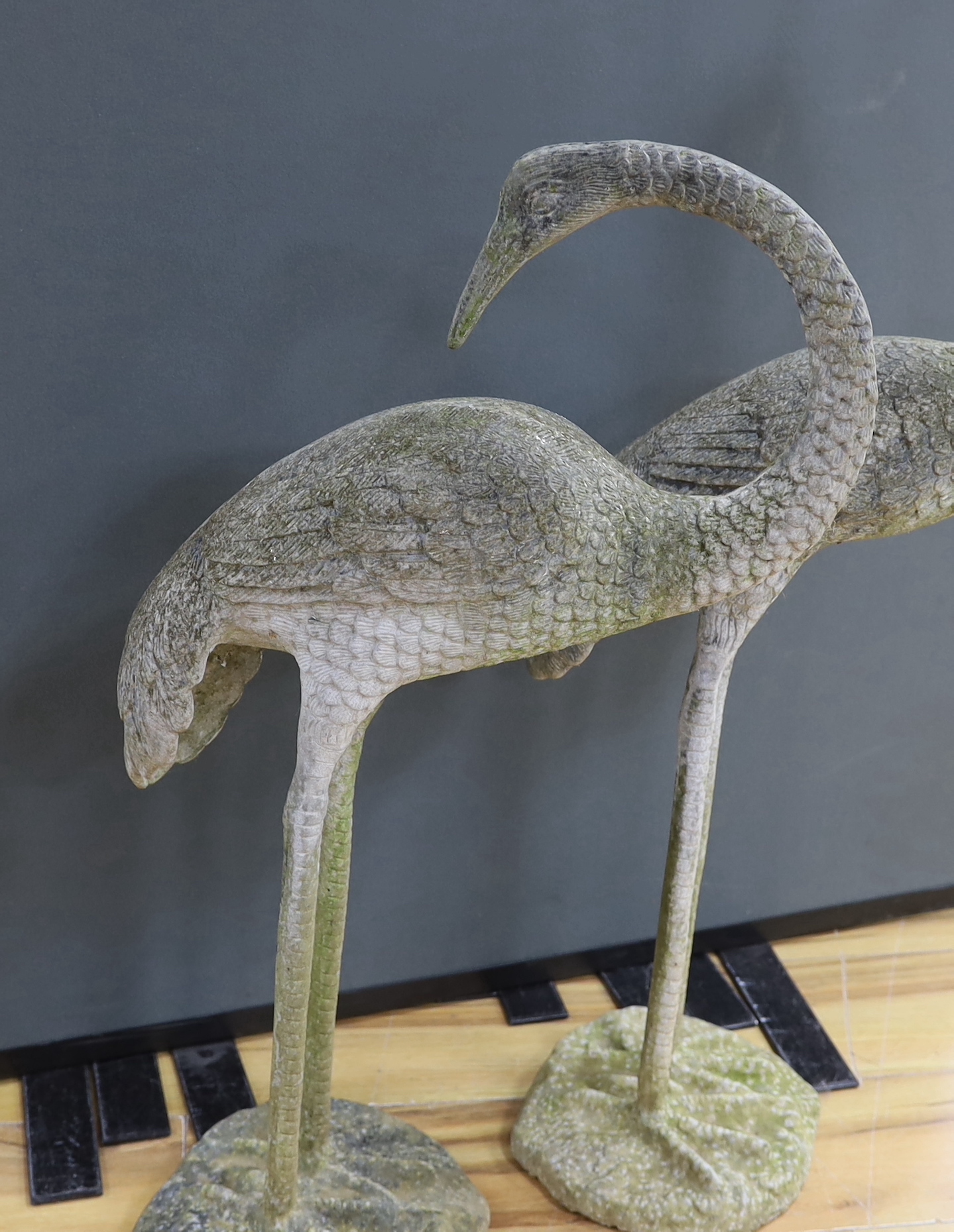 A large pair of weathered metal storks, 95cm